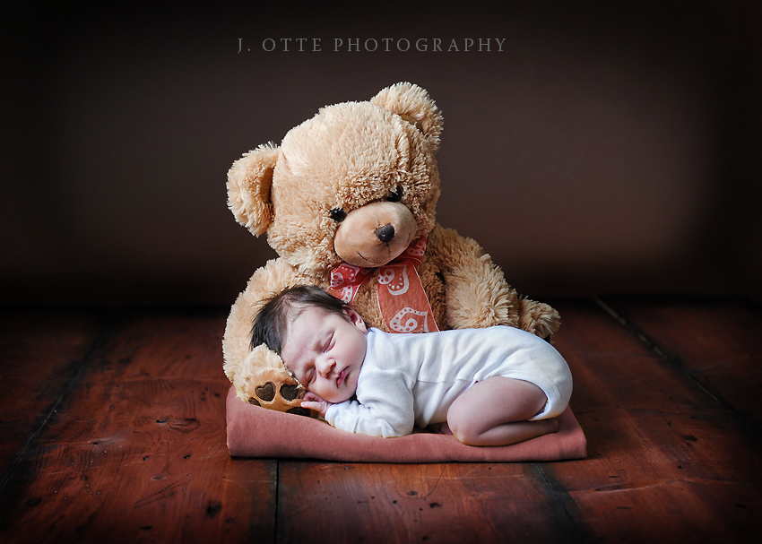 newborn and teddy bear